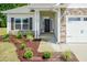 Inviting front entrance with stone facade and covered porch at 51 Sunburst Ct, Fuquay Varina, NC 27526