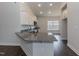 Kitchen boasts granite countertops and white cabinetry at 51 Sunburst Ct, Fuquay Varina, NC 27526