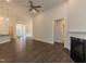 Open living room with hardwood floors and a view into the kitchen at 51 Sunburst Ct, Fuquay Varina, NC 27526