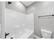 Clean bathroom with shower/tub combo and modern finishes at 517 Shawnee Dr, Louisburg, NC 27549