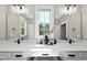 Spa-like bathroom with double vanity and large window at 517 Shawnee Dr, Louisburg, NC 27549