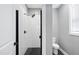 Modern bathroom with a walk-in shower and hexagon tile floor at 517 Shawnee Dr, Louisburg, NC 27549