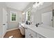Elegant bathroom boasts double vanity, modern fixtures, and natural light at 517 Shawnee Dr, Louisburg, NC 27549