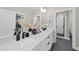 Bathroom with double vanity, black matte fixtures, and a walk-in shower at 517 Shawnee Dr, Louisburg, NC 27549