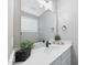 Clean bathroom with a single vanity and large mirror at 517 Shawnee Dr, Louisburg, NC 27549