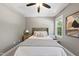 Serene bedroom featuring a ceiling fan and large windows at 517 Shawnee Dr, Louisburg, NC 27549