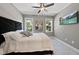 Stylish bedroom with a plush bed and wall-mounted TV at 517 Shawnee Dr, Louisburg, NC 27549