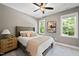 Bright bedroom with a comfortable bed and plenty of natural light at 517 Shawnee Dr, Louisburg, NC 27549