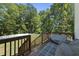 Spacious deck overlooking a fenced backyard and wooded area at 517 Shawnee Dr, Louisburg, NC 27549