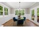 Bright dining room with a round table and four blue velvet chairs at 517 Shawnee Dr, Louisburg, NC 27549