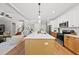 Open concept kitchen with island and stainless steel appliances at 517 Shawnee Dr, Louisburg, NC 27549