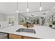 Kitchen island with sink overlooking living room at 517 Shawnee Dr, Louisburg, NC 27549
