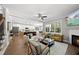 Open living space with fireplace, large windows, and modern furniture at 517 Shawnee Dr, Louisburg, NC 27549