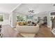 Open living area with corner fireplace and ample natural light at 517 Shawnee Dr, Louisburg, NC 27549