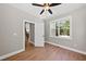 Bright home office features hardwood floors and a view of the wooded backyard at 517 Shawnee Dr, Louisburg, NC 27549