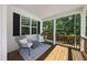 Relaxing porch with wooden flooring and wicker chairs at 517 Shawnee Dr, Louisburg, NC 27549