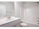 Clean and bright bathroom with white fixtures and a shower/tub combo at 54 Northwood Dr, Fuquay Varina, NC 27526