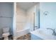 Clean and bright bathroom with bathtub, single vanity, and tiled floors at 54 Northwood Dr, Fuquay Varina, NC 27526