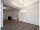 Dining room with chandelier, wainscoting, and view of living room at 54 Northwood Dr, Fuquay Varina, NC 27526