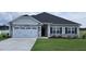 Two-story house with stone accents and a two-car garage at 54 Northwood Dr, Fuquay Varina, NC 27526