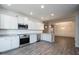 Bright kitchen with stainless steel appliances and white cabinetry at 54 Northwood Dr, Fuquay Varina, NC 27526