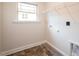 Dedicated laundry room with shelving and tile flooring at 54 Northwood Dr, Fuquay Varina, NC 27526