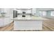 White kitchen island with granite countertop, spacious and open to living area at 5704 Whippoorwill St, Durham, NC 27704