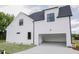 White two story house with an attached garage and open driveway at 75 Kettle Creek Dr, Zebulon, NC 27597