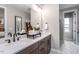 Elegant bathroom with double vanity, modern fixtures and a large mirror at 1212 Holding Village Way, Wake Forest, NC 27587