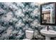 Powder room with designer wallpaper and modern vanity at 1212 Holding Village Way, Wake Forest, NC 27587