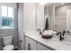 Bright bathroom with double vanity and white quartz countertop at 1212 Holding Village Way, Wake Forest, NC 27587