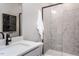 Modern bathroom with a hexagonal tile shower and floating vanity at 1212 Holding Village Way, Wake Forest, NC 27587
