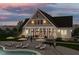 Elegant clubhouse with pool and outdoor seating areas at 1212 Holding Village Way, Wake Forest, NC 27587