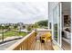 Private deck with yellow chair and community views at 1212 Holding Village Way, Wake Forest, NC 27587