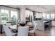 Modern eat-in kitchen with island, stainless steel appliances, and white cabinets at 1212 Holding Village Way, Wake Forest, NC 27587