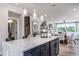 Open concept kitchen with large island, breakfast area, and views into living room at 1212 Holding Village Way, Wake Forest, NC 27587
