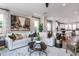 Open living space with sectional sofa, coffee table, and kitchen views at 1212 Holding Village Way, Wake Forest, NC 27587