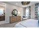 Main bedroom with dresser, seating area, and en-suite bathroom access at 1212 Holding Village Way, Wake Forest, NC 27587