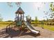 Modern playground with slide and climbing structure for children at 1212 Holding Village Way, Wake Forest, NC 27587