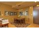 Bright dining area with mid-century modern table and chairs at 140 W Franklin St # 800, Chapel Hill, NC 27516