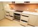 Modern kitchen with stainless steel appliances and ample cabinetry at 140 W Franklin St # 800, Chapel Hill, NC 27516