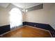 Bright dining room with hardwood floors, crown molding, and a large window at 2332 Brasswynd Ct, Fuquay Varina, NC 27526