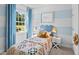 Cozy bedroom with light blue walls and a comfortable bed at 40 Saddle Mare St, Clayton, NC 27520
