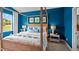 Bright bedroom with canopy bed and view of nature at 40 Saddle Mare St, Clayton, NC 27520