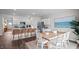 Open concept dining area with wood table and white chairs at 40 Saddle Mare St, Clayton, NC 27520