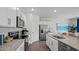 Modern kitchen with stainless steel appliances and granite countertops at 40 Saddle Mare St, Clayton, NC 27520