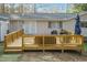 Large wooden deck with seating area at 5829 Sandstone Dr, Durham, NC 27713
