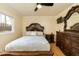 Bedroom with a queen bed, dresser, and a ceiling fan at 5829 Sandstone Dr, Durham, NC 27713