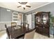 Dining area with a dark wood table and sliding barn doors at 5829 Sandstone Dr, Durham, NC 27713