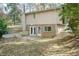Back exterior view with patio and access to the basement at 5829 Sandstone Dr, Durham, NC 27713